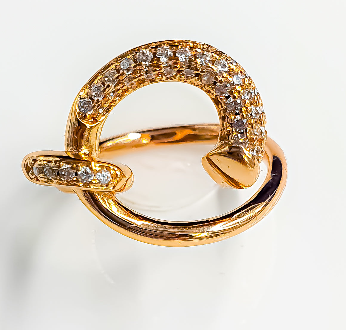 Discover the allure of Raani's Serpentine Dance Ring, an anti-tarnish serpentine statement ring designed to captivate. This exquisite piece features a fluid band that elegantly spirals around a stunning cluster of American Diamonds. Each diamond catches the light beautifully, adding brilliance and sophistication to the design. Adorn yourself with this anti-tarnish serpentine statement ring and let it become a cherished part of your style.