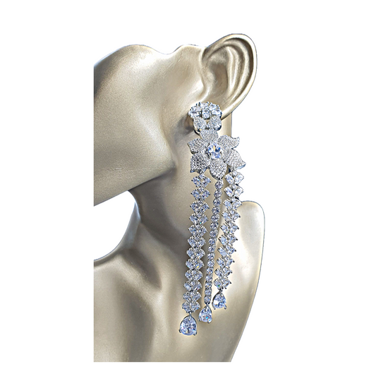 Shine bright at your next formal event with Raani's long statement dangler earrings for women. Crafted for elegance, these stunning earrings feature cascading platinum-finish titanium steel chains that ooze luxury and sophistication. Sparkling American diamonds adorn each chain, capturing and reflecting light with every movement. Lightweight and comfortable, these long statement dangler earrings for women allow you to enjoy your evening without any hassle.