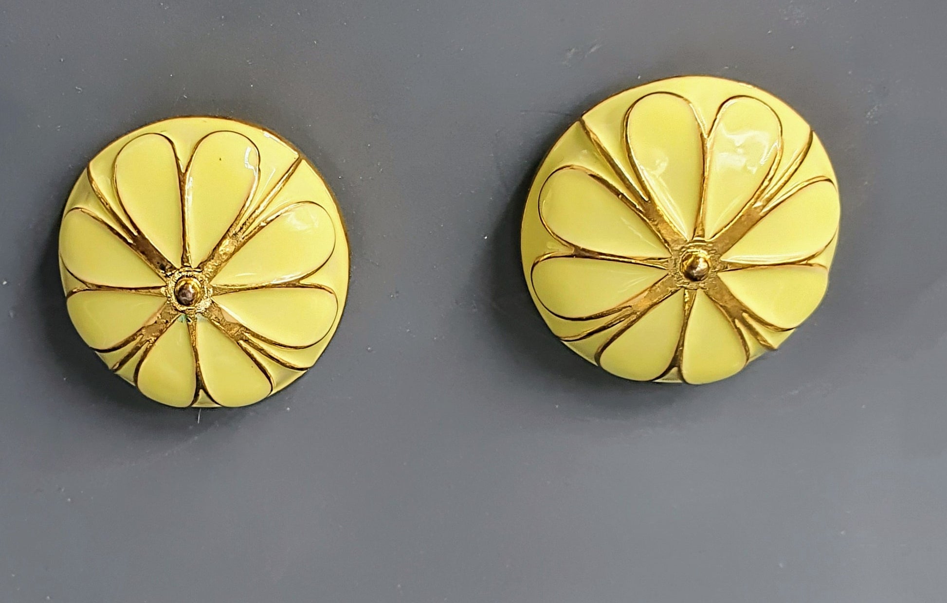 Bring a ray of sunshine wherever you go with yellow light-weight studs for daily wear. These charming earrings feature a subtle yellow lacquer coating over hypoallergenic, lightweight gold-finish metal. Their bright hue adds a touch of cheerfulness to any outfit, making them ideal for everyday use.