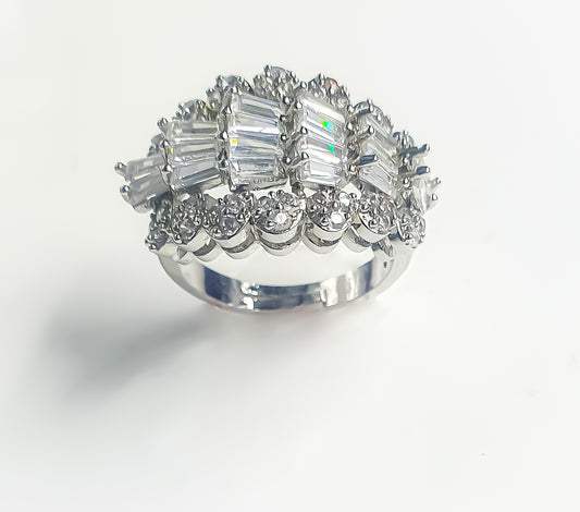 Introducing Raani's Sparkling Eternity Ring, a Cubic zirconia art deco statement ring. This beautiful piece offers everyday sparkle that lasts for an eternity. The timeless design suits any occasion, adding a touch of elegance to every look.