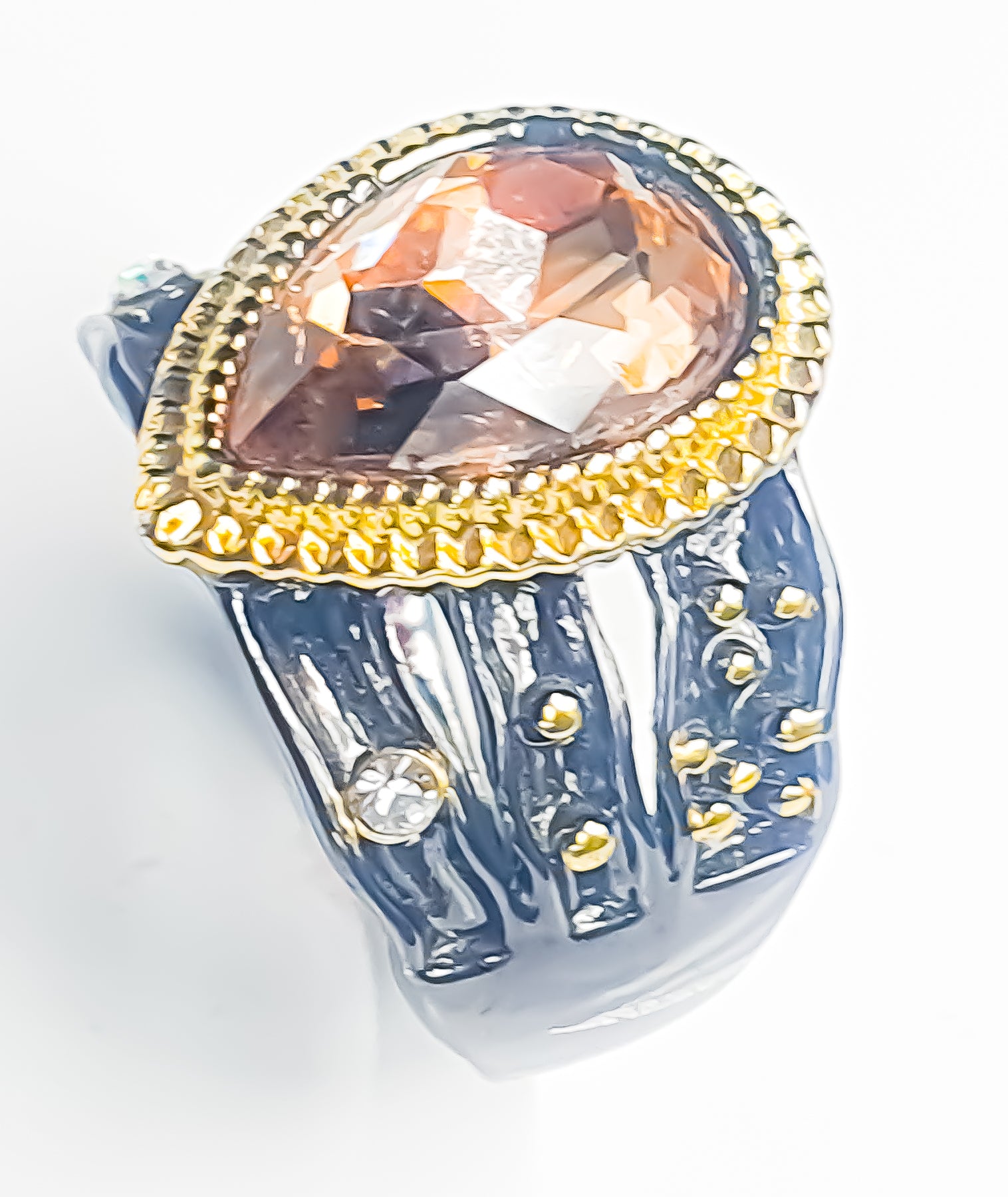 Embody timeless elegance with this black and amber colour statement ring. Raani's Rich Amber Ring features a warm-toned amber-coloured centrepiece that mesmerises with its rich hue. Surrounding the centrepiece, lustrous cubic zirconia adds a touch of brilliance, creating a luxurious and sophisticated look.