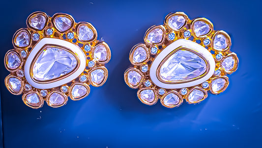 Enhance your style with Raani's Chandini Studs, featuring sophisticated Indian Kundan studs with American Diamonds. These exquisite pieces blend the brilliance of silver-foil Kundan and American diamonds in a Deco-inspired design. Their versatile elegance makes them perfect for any occasion.