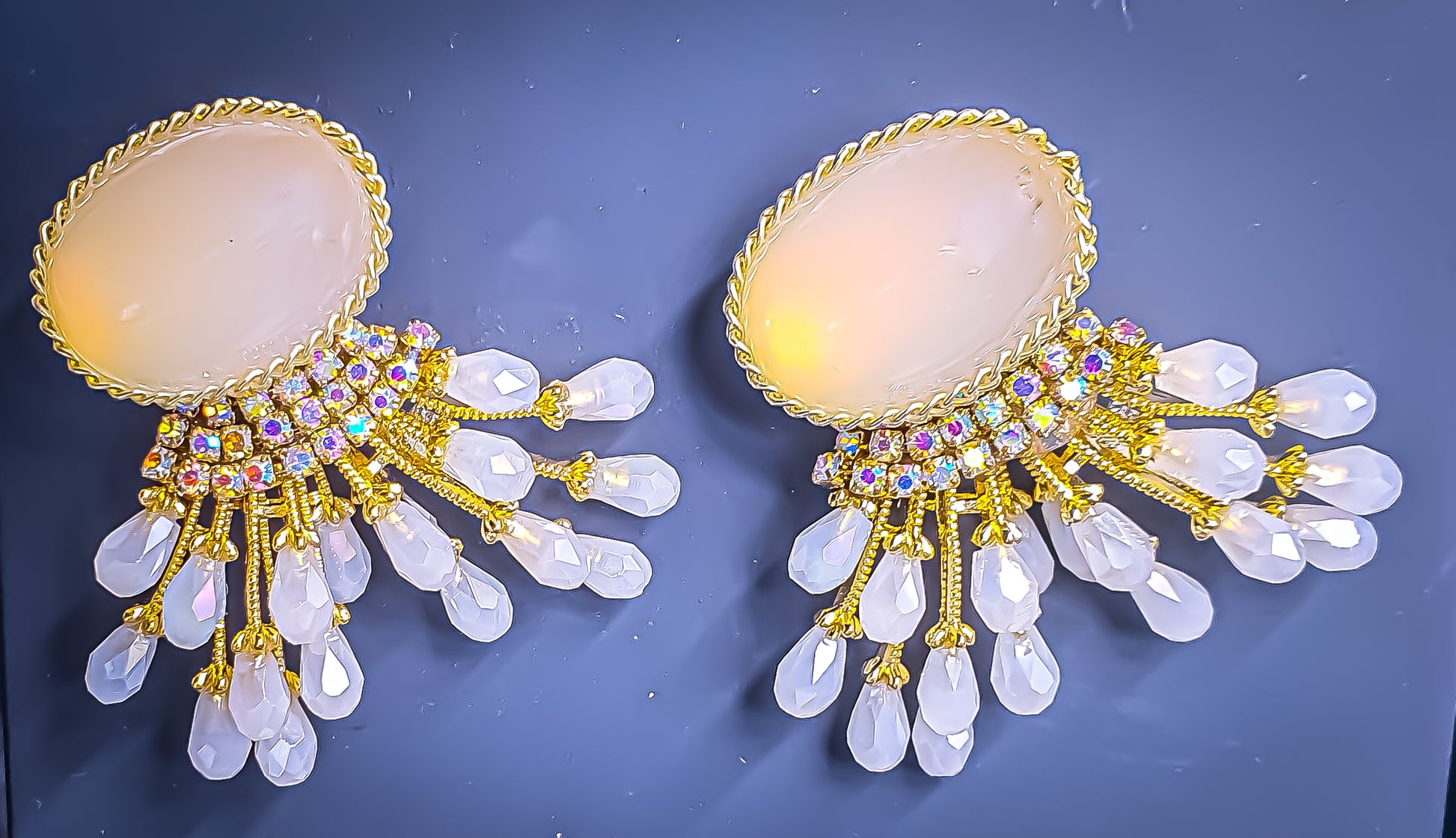 Introducing Raani's White Light Earrings, the perfect light weight earrings for daily wear. Designed for all-day comfort, these earrings feature a cascade of sparkling American Diamonds set in a gleaming gold-finish metal alloy. The sophisticated double-drop design ensures you turn heads wherever you go.