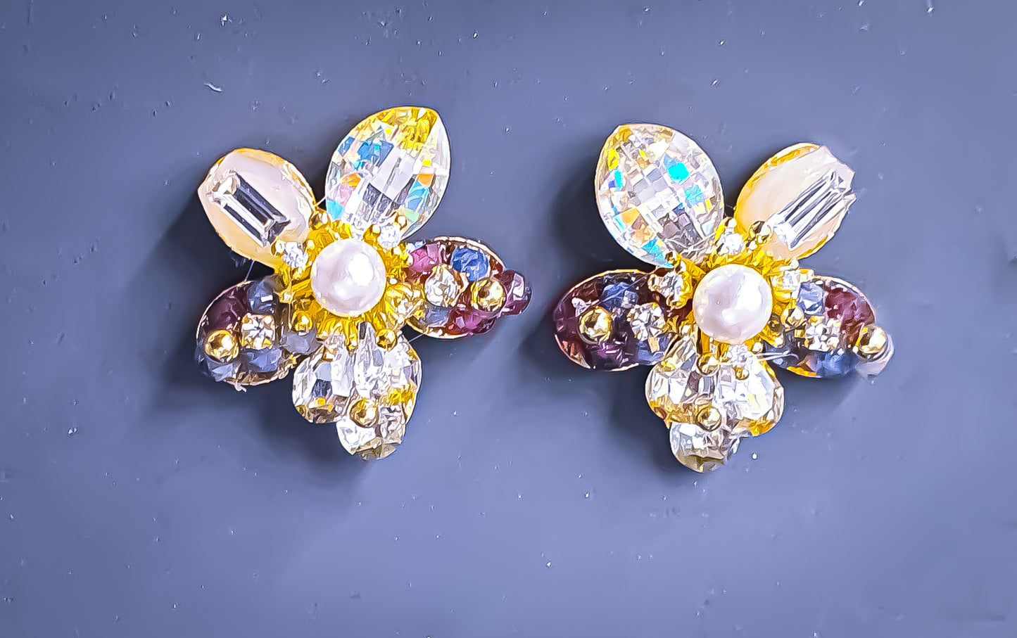 Add a touch of pearlescent shimmer to your everyday style with light-weight pearls and cubic zirconia studs. These exquisite earrings offer a perfect blend of elegance and comfort, making them an ideal choice for daily wear.