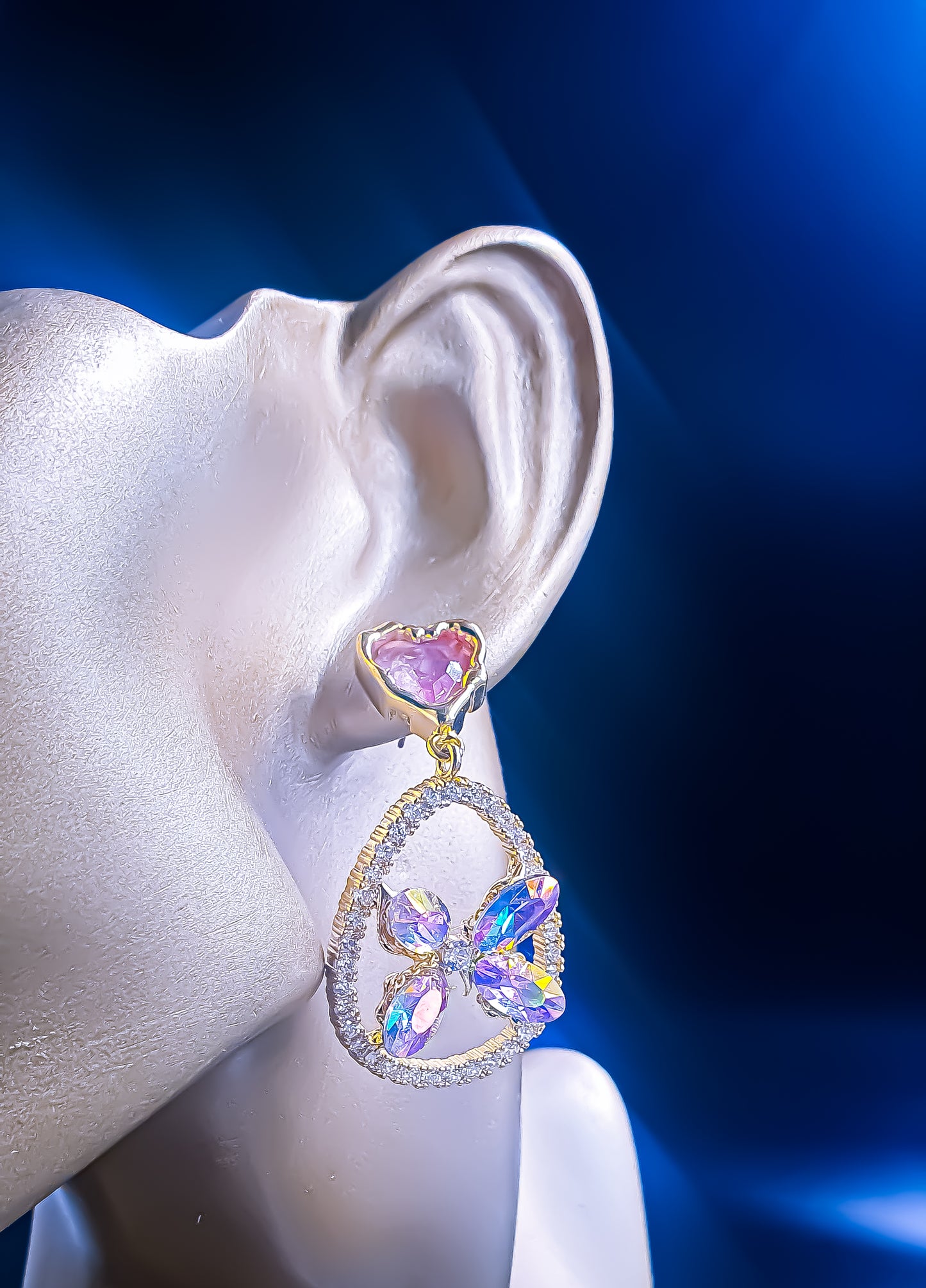 Add a touch of romantic elegance to any outfit with these elegant lightweight dangler earrings. Featuring a playful gradient of pink and white cubic zirconia, these earrings sparkle brilliantly against a delicate gold-tone setting. The combination of colors creates a soft, feminine allure that enhances any look, whether you're dressing up for a special occasion or adding a bit of glamour to your everyday style.