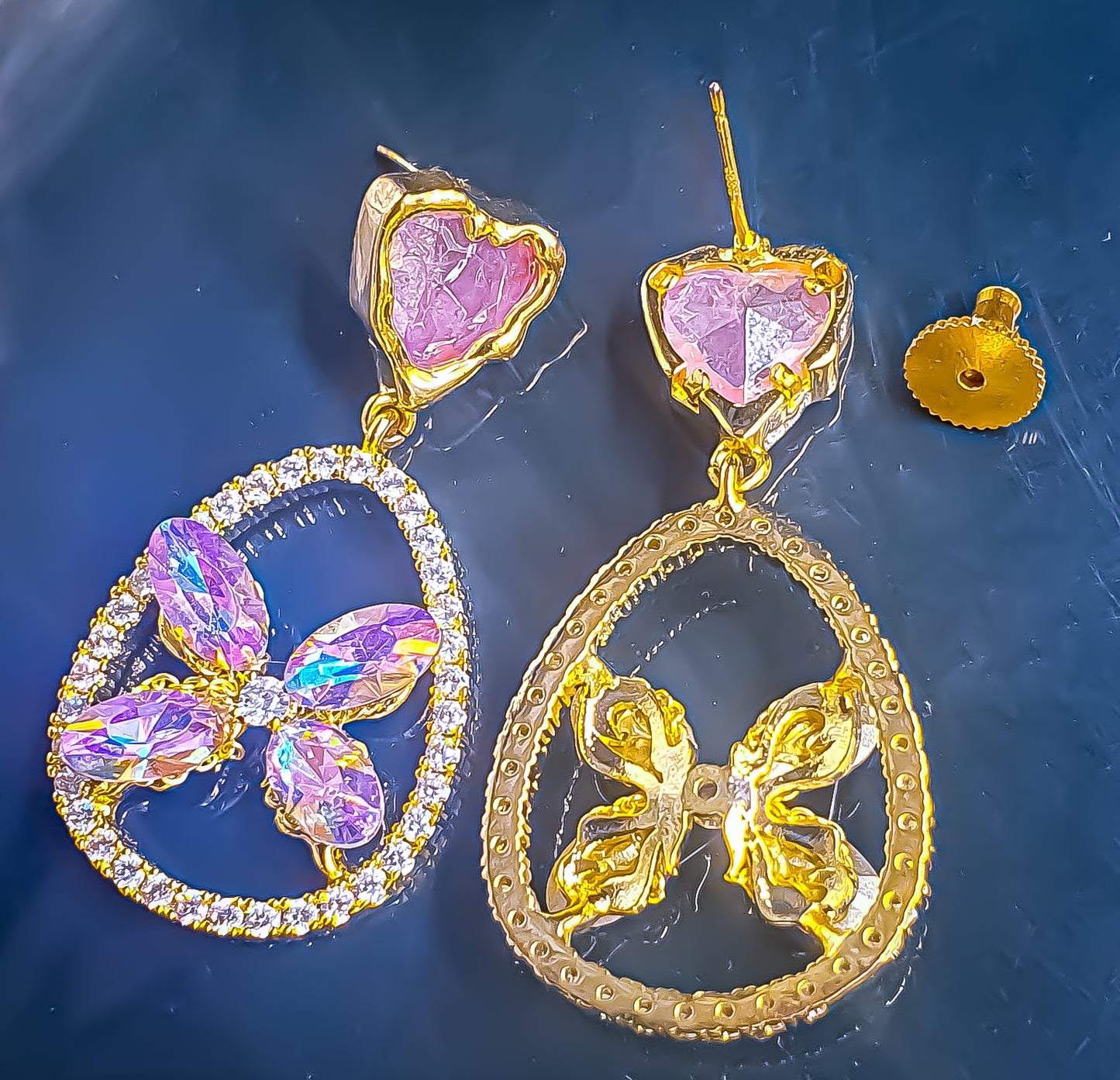 Add a touch of romantic elegance to any outfit with these elegant lightweight dangler earrings. Featuring a playful gradient of pink and white cubic zirconia, these earrings sparkle brilliantly against a delicate gold-tone setting. The combination of colors creates a soft, feminine allure that enhances any look, whether you're dressing up for a special occasion or adding a bit of glamour to your everyday style.