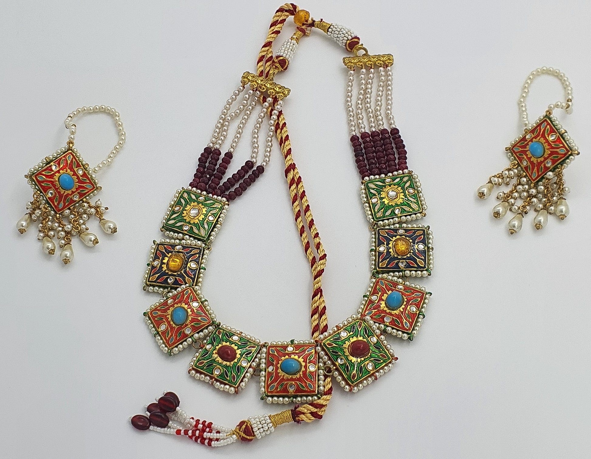 Shine in this exquisite colourful Indian ethnic light-weight necklace set, hand-crafted and studded with multi-coloured semi-precious stones. This beautiful set features high-quality gold plating and a light-weight design, making it perfect for pairing with all Indian ethnic dresses, especially designer lehenga cholis.