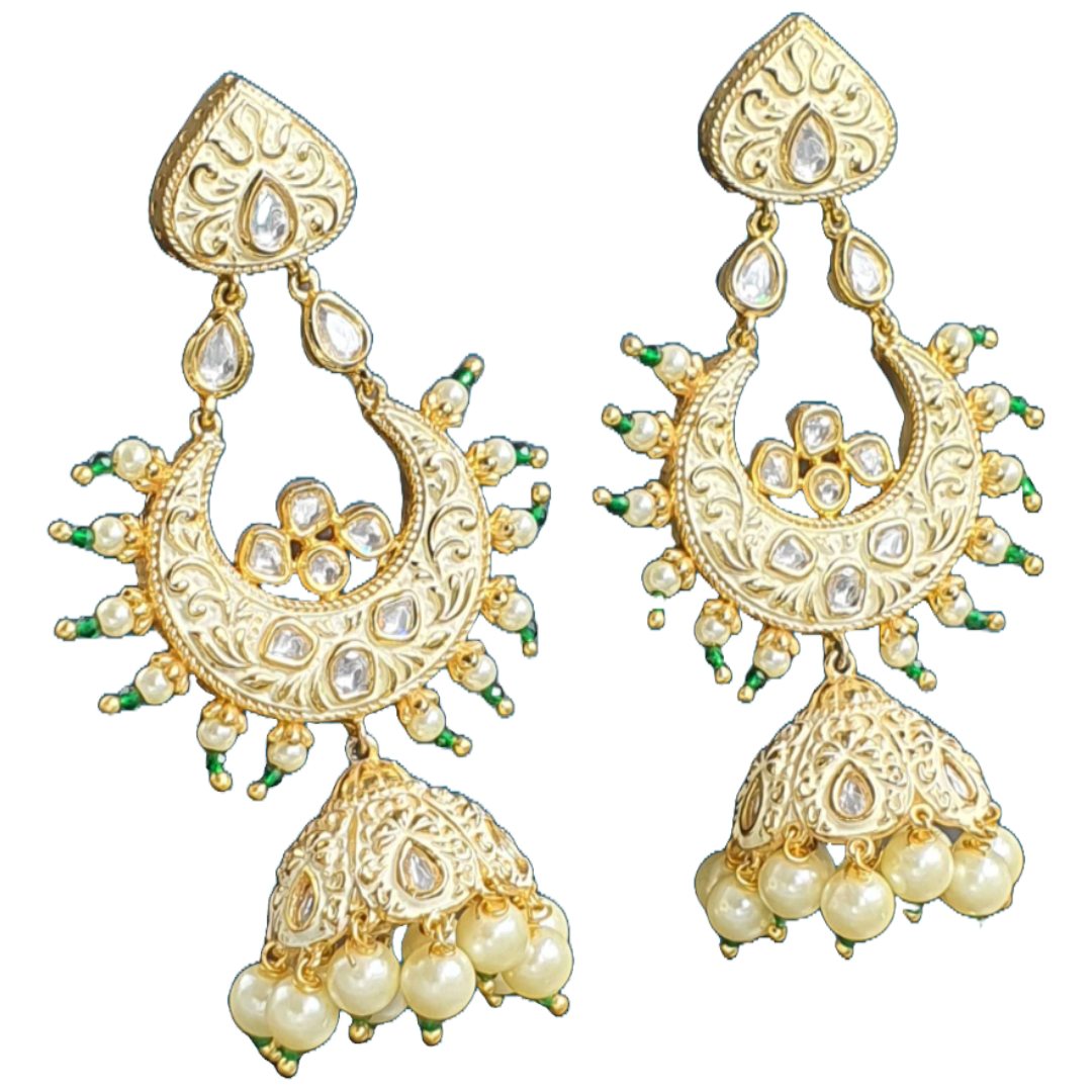 Raani's ivory colour Jodhpuri chandbali jhumkas with minakari and little pearls are a testament to exquisite Indian artistry. Gold-plated brass forms the intricate base, embellished with gleaming pearls and sparkling silver-foil kundan. The delicate golden minakari work on an ivory backdrop adds a touch of traditional colour, making these chandbali jhumka earrings a timeless treasure.