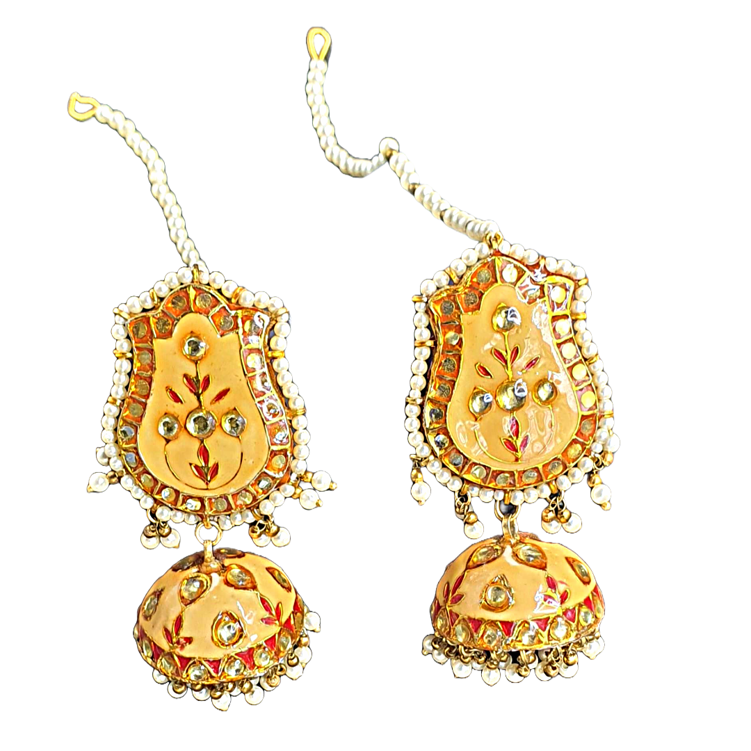 Introducing mustard yellow light-weight minakari jhumkas with little pearls !.&nbsp; Raani's Jhyank Jhumkas embody the timeless elegance of traditional Indian jewellery. Their intricate design and playful movement of glass pearls elevate any outfit, while their surprisingly lightweight construction ensures all-day comfort. Feel like royalty with these exquisite hand-crafted jhumkas.