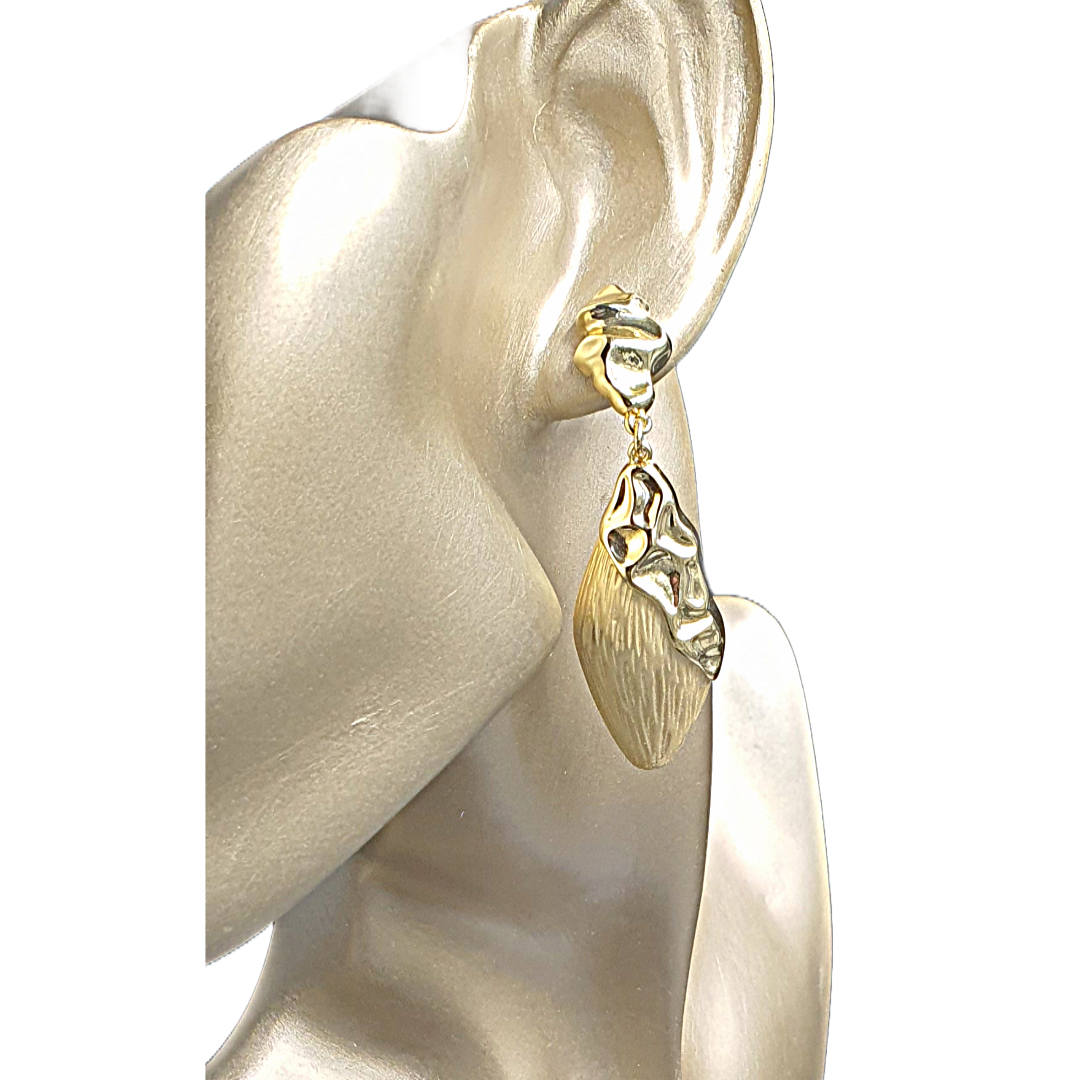 Raani's Golden Foliage Earrings are lightweight, ensuring comfortable wear throughout the day. The shimmering gold finish enhances their allure, making them a versatile accessory for both casual and formal occasions. Their intricate design captures the essence of natural beauty while adding a sophisticated touch to your look.