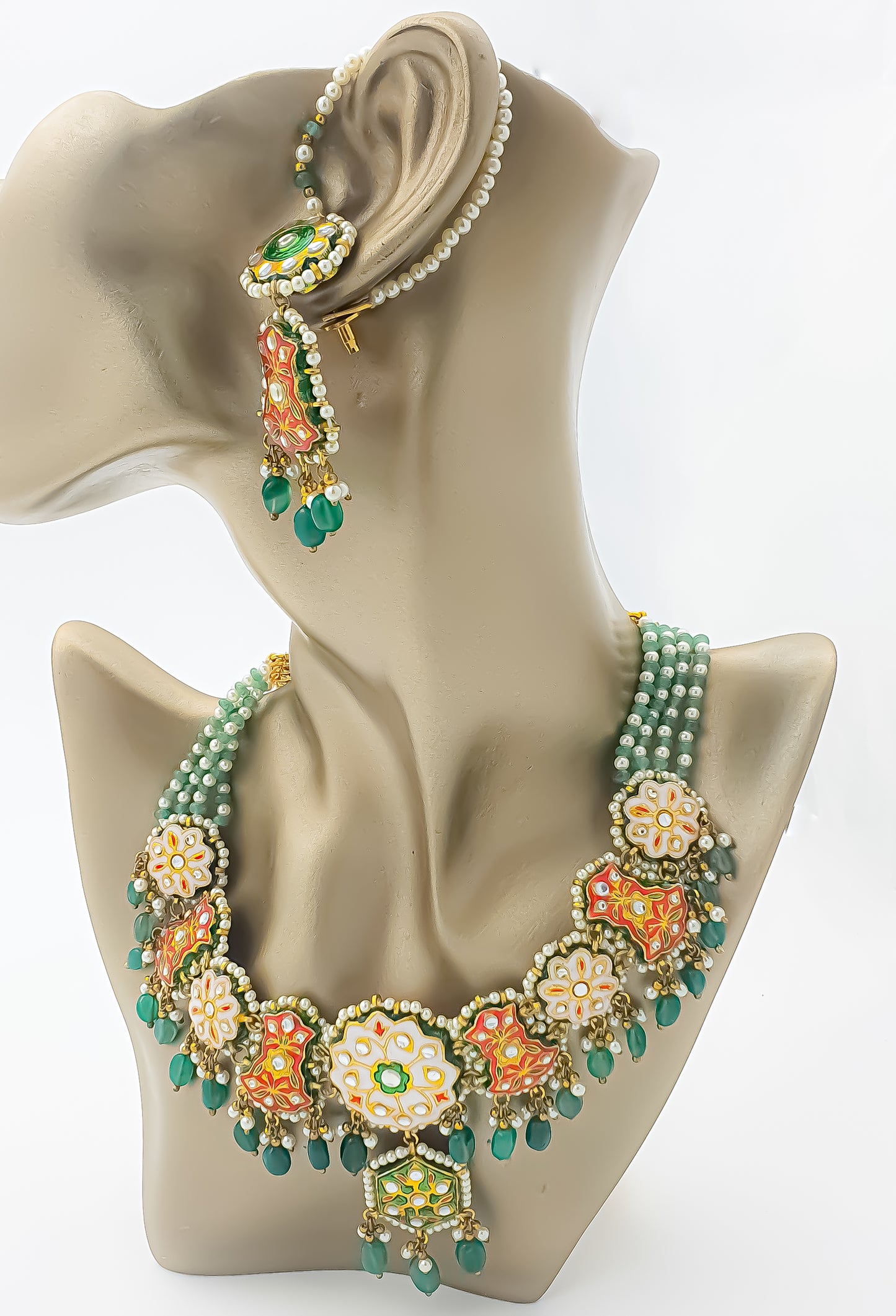 Introducing Raani's Rajasthani Tarangini Necklace Set, an Ethnic Rajasthani Necklace Set with Pearls.&nbsp; This set embodies the vibrant spirit and rich cultural heritage of Rajasthan. This enchanting ensemble captures the essence of Rajasthani folklore and traditional dance forms, exuding grace, charm, and timeless elegance.