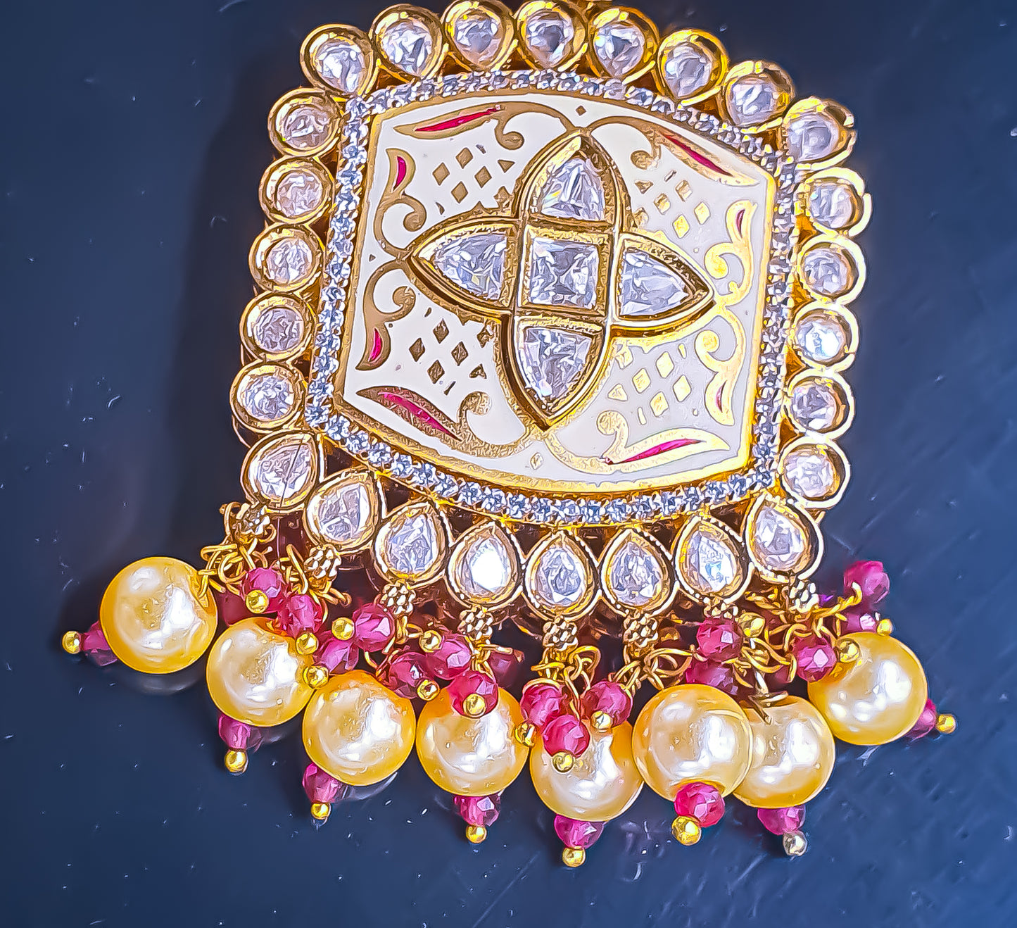 Introducing Raani's Ethnic Indian designer earrings with Kundan, pearls and cubic zirconia that are perfect for any special occasion. Aptly called Raani's Maya Earrings, these elegant earrings feature a gold-plated square design with intricate detailing, showcasing the beauty of traditional craftsmanship.